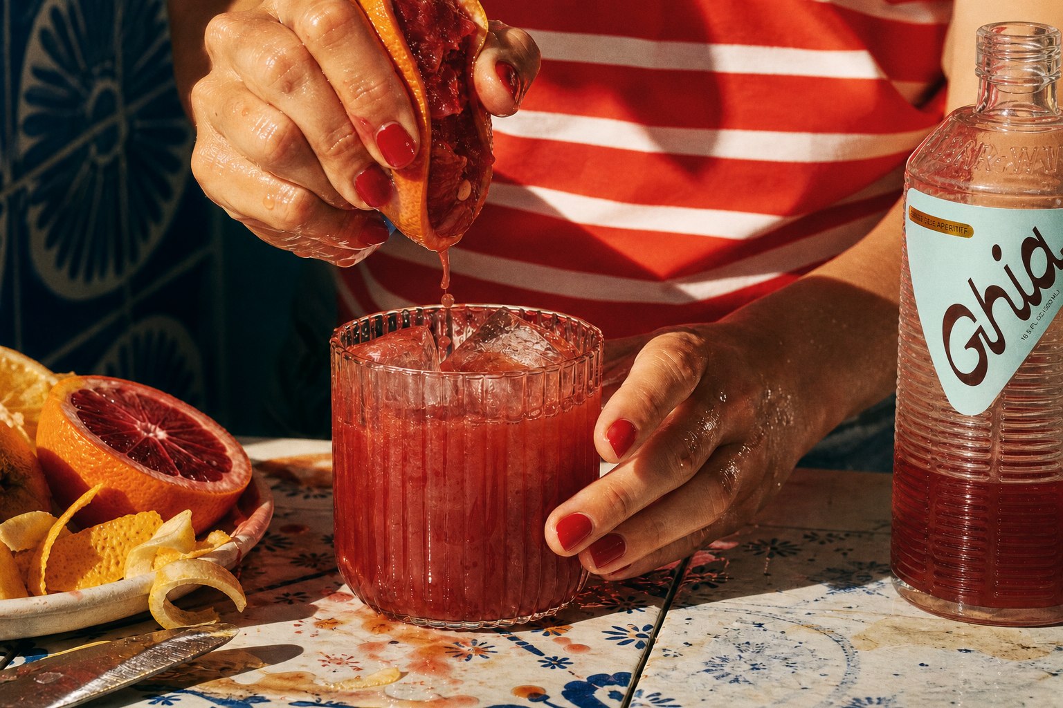 Blood orange squeezed into a Ghia aperitif glass